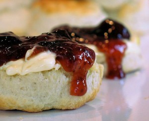 Fresh scones with clotted cheese and your choice of lemon curd or fruit preserves