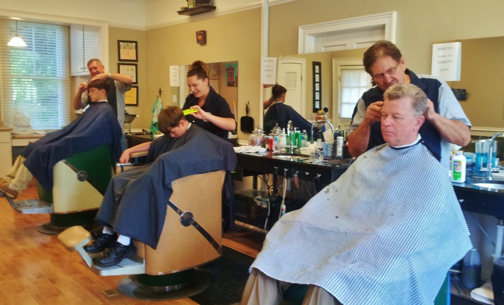 Barbers from far left: Patrick O'Brien, Cherish Fink & Hal Moberg