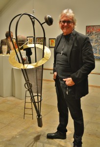 Thomas Mann, one of the featured artists in this exhibit, pictured with his work.