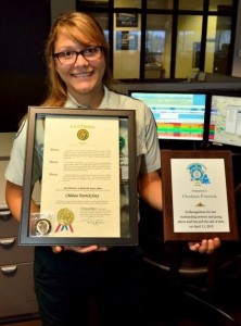 Chelsea Feerick with the proclamation from Mayor Cooper and plaque from the CPD