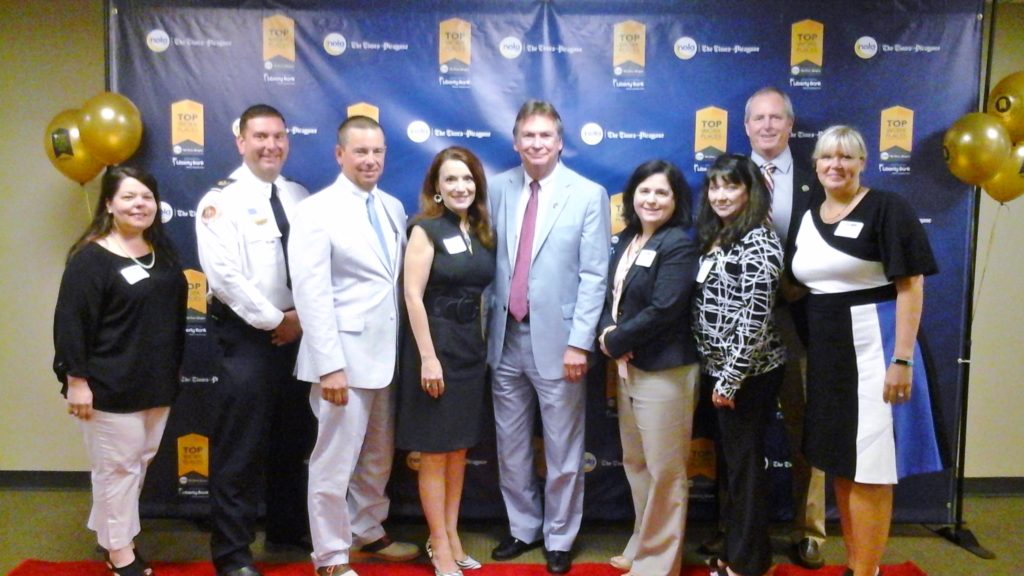 (L–R) Denise Windom, CFD Assistant Chief Steven Michell,  CPD Chief Tim Lentz, Gina Hayes, Mayor Mike Cooper, Kelli Moore, Ann Hare, Councilman Rick Smith, Cheryl Andrus 